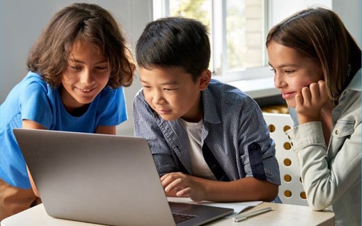 Three kids at a laptop