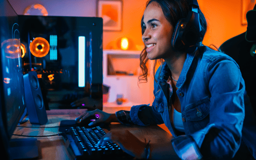 A young person playing on a gaming PC